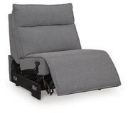 Ashley Furniture Modmax reclining sectional with built-in audio console, open view showing plush seating and integrated sound system.