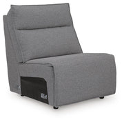 Ashley Furniture Modmax reclining sectional with built-in audio console shown from an angle, featuring plush cushions and modern design.