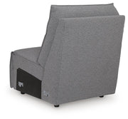 Ashley Furniture Modmax reclining sectional with built-in audio console, featuring plush cushions and a modern design.