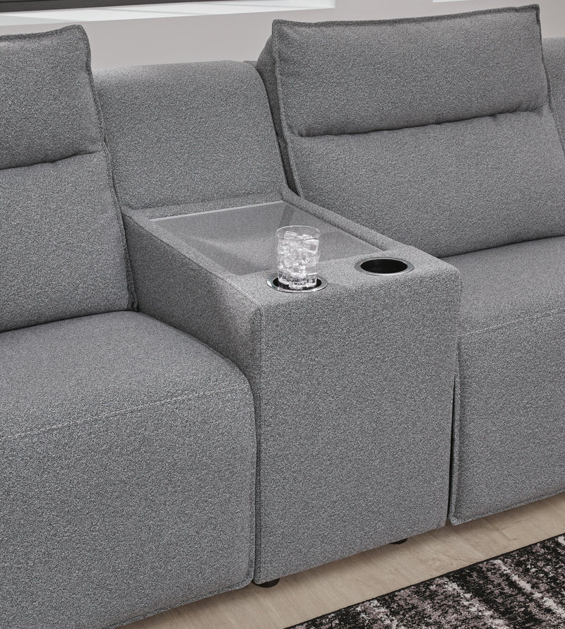 Ashley Furniture Modmax reclining sectional with built-in console, showing close-up of the console and reclining features.
