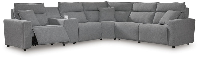 Ashley Furniture Modmax reclining sectional with built-in console, featuring plush cushions and modern design.