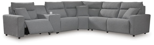 Ashley Furniture Modmax reclining sectional with built-in console, featuring plush cushions and modern design.