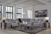 Ashley Furniture Modmax II Power Reclining Sectional with built-in audio consoles, featuring plush cushions and modern design.