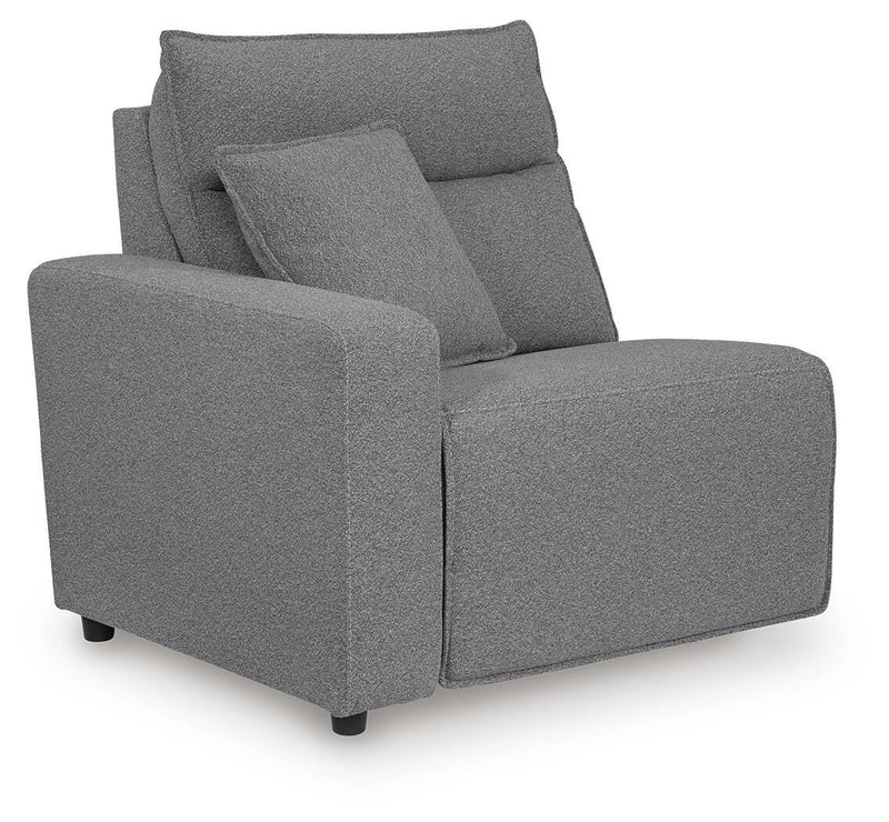 Ashley Furniture Modmax reclining sectional with integrated audio console, shown from an angle highlighting the plush cushions and sofa design.
