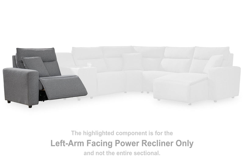 Ashley Furniture Modmax reclining sectional with built-in audio console, featuring plush cushions and modern design.