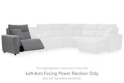 Ashley Furniture Modmax II power reclining sectional with built-in audio consoles, featuring plush cushions and modern design.