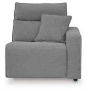 Ashley Furniture Modmax reclining sectional with built-in audio console, showing plush cushions and integrated speaker controls.