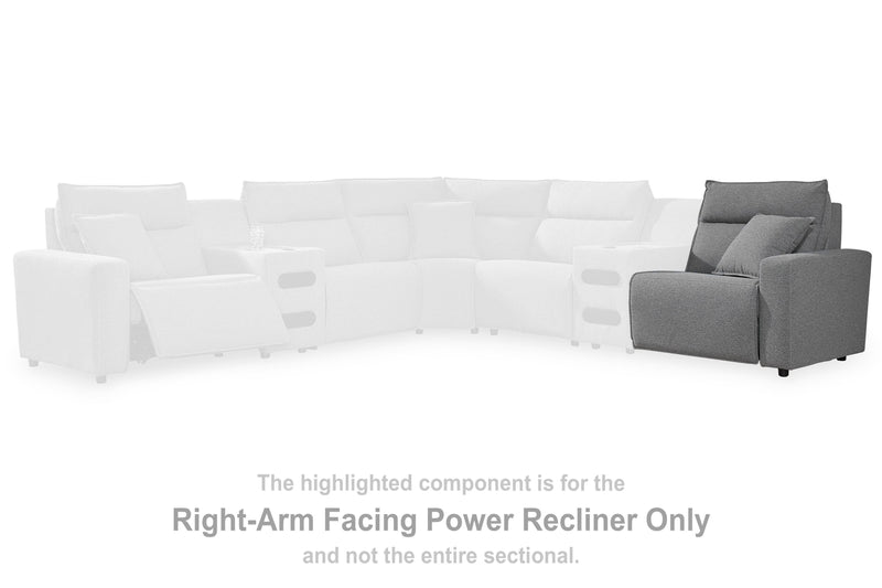 Ashley Furniture Modmax II Power Reclining Sectional with integrated audio consoles, featuring plush cushions and modern design.