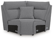 Ashley Furniture Modmax II power reclining sectional with built-in audio consoles, shown from a front head-on view.