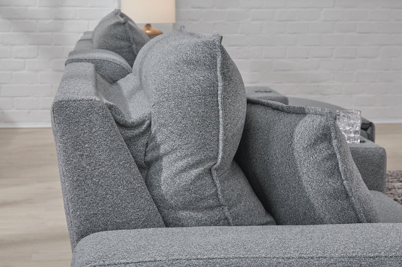 Ashley Furniture Modmax II power reclining sectional with built-in audio consoles, featuring plush cushions and modern design.