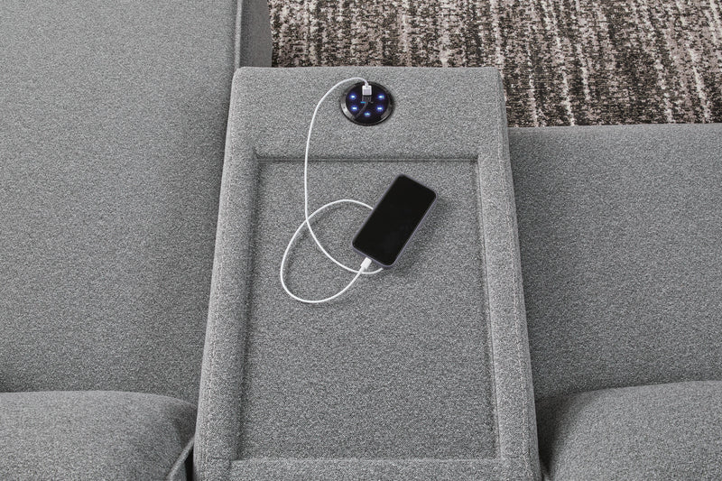 Ashley Furniture Modmax Power Reclining Sectional with USB charging ports, featuring plush cushions and modern design.