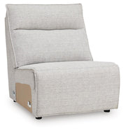 Ashley Furniture Modmax II reclining sectional sofa with chaise, featuring plush cushions and a modern design, viewed from an angle.
