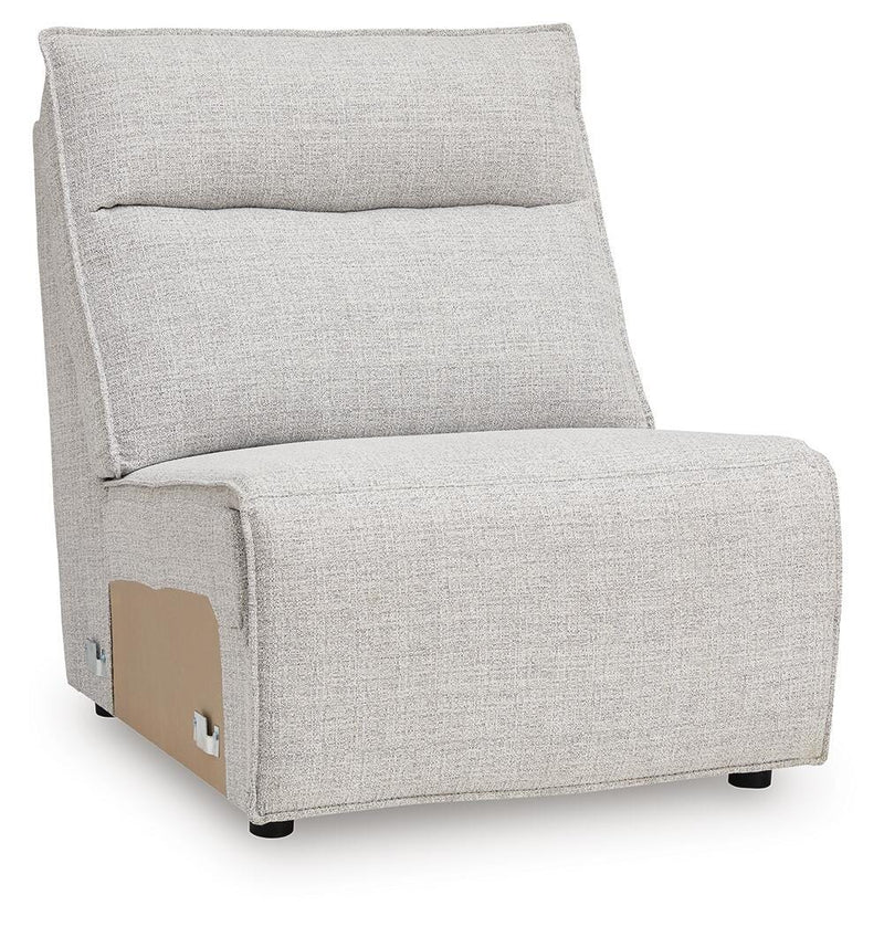 Ashley Furniture Modmax II reclining sectional sofa with chaise, featuring plush cushions and a modern design, viewed from an angle.