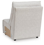 Ashley Furniture Modmax II reclining sectional sofa with chaise, shown from the back in a modern living room setting.