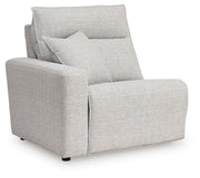 Ashley Furniture Modmax II power reclining sectional with built-in audio consoles, shown from an angled view in a modern living room.