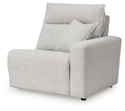 Ashley Furniture Modmax II power reclining sectional with built-in audio consoles, shown from an angled view in a modern living room setting.