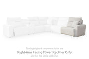 Ashley Furniture Modmax II power reclining sectional with built-in audio consoles, featuring plush cushions and modern design.