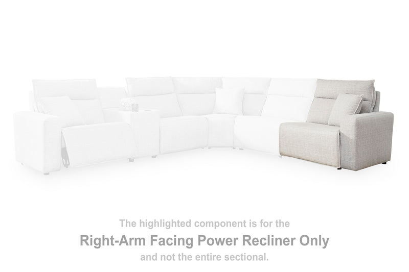 Ashley Furniture Modmax II power reclining sectional with built-in audio consoles, featuring plush cushions and modern design.