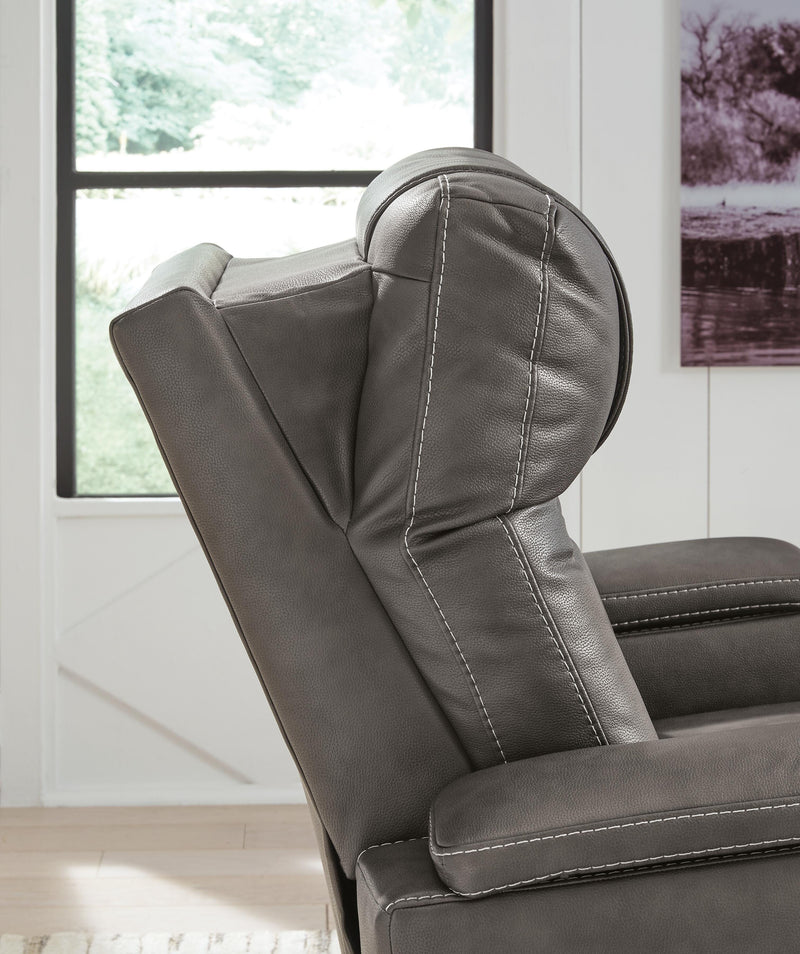 Ashley Furniture Feazada Power Recliner showing plush upholstery, padded armrests, and reclining mechanism.