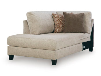 Ashley Furniture Steelwater Retreat sectional with chaise, showing a spacious, plush fabric sofa with a modern design from an angled view.