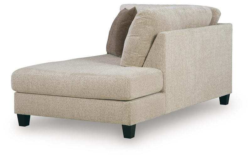Ashley Furniture Steelwater Retreat sectional with chaise, featuring plush cushions and modern design, angled view highlighting seating arrangement.