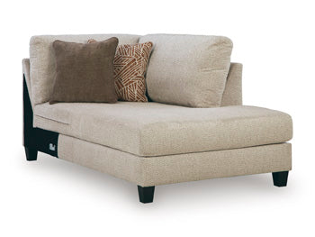 Ashley Furniture Steelwater Retreat sectional with chaise, featuring plush cushions and modern design, shown from an angled view.