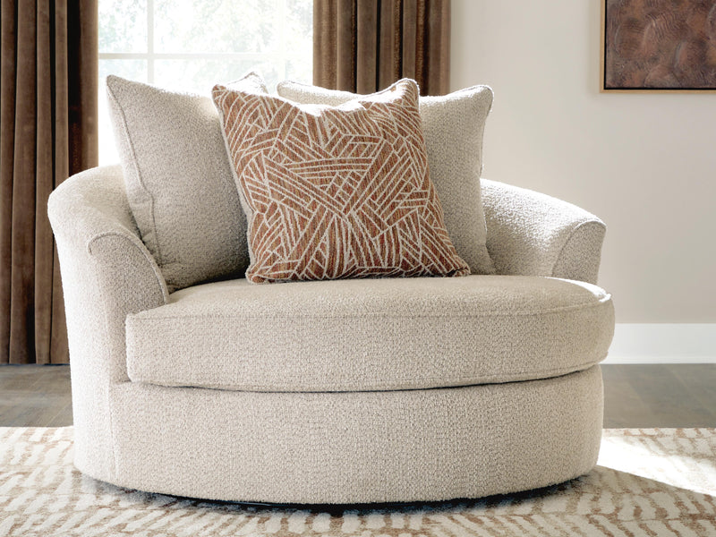 Ashley Furniture Steelwater Retreat oversized swivel accent chair with plush upholstery and wooden legs, shown in a stylish living room setting.