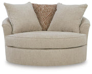 Ashley Furniture Steelwater Retreat oversized swivel accent chair with plush fabric and rounded armrests, shown from a head-on angle.