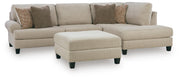 Ashley Furniture Steelwater Retreat living room set with sofa and armchair, featuring neutral fabric upholstery and decorative cushions.