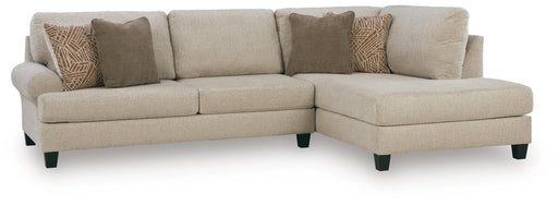 Ashley Furniture Steelwater Retreat sectional with chaise, featuring plush cushions and modern design in a cozy living room setting.