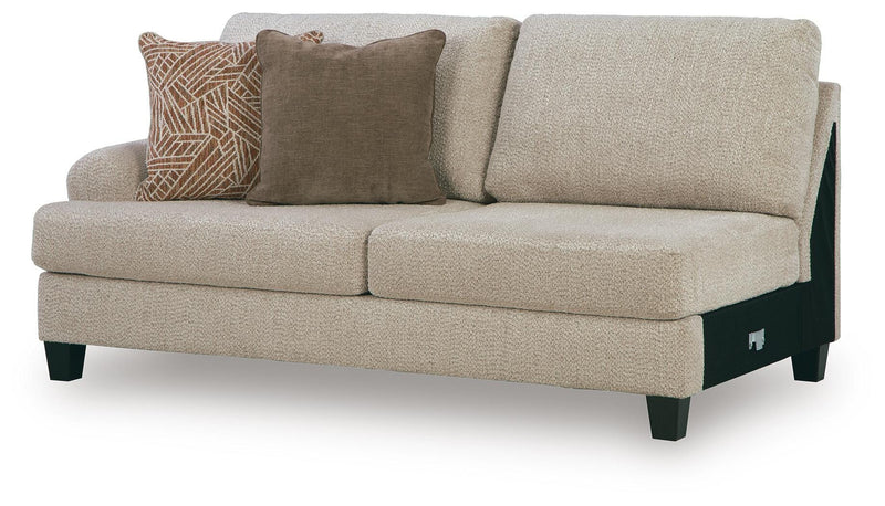 Ashley Furniture Steelwater Retreat sectional with chaise, showcasing plush fabric upholstery and modern design from an angled view.