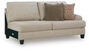 Ashley Furniture Steelwater Retreat sectional with chaise, showing the modern sectional sofa from a stylish angled view.