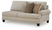 Ashley Furniture Steelwater Retreat sectional with chaise, showing a modern fabric sofa with cushions and a chaise lounge in neutral tones.