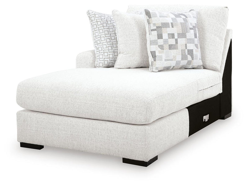 Ashley Furniture Misty-Lakes Super Chaise sectional with plush cushions and a sleek modern design, shown from an angled view.