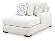 Ashley Furniture Misty-Lakes sectional with chaise, showing plush fabric upholstery and modern design from an angled perspective.