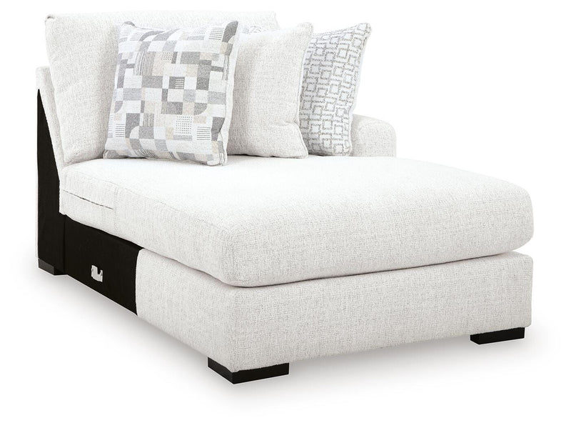 Ashley Furniture Misty-Lakes sectional with chaise, featuring plush upholstery and a spacious design, shown from an angled view.