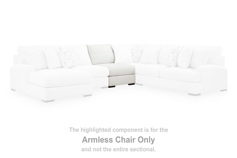 Ashley Furniture Misty-Lakes sectional with chaise, featuring plush upholstery and modern design in a cozy living room setting