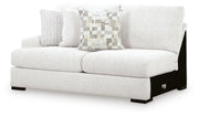 Ashley Furniture Misty-Lakes sectional with chaise, shown from an angled view, featuring plush cushions and a modern design.