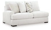 Ashley Furniture Misty-Lakes sectional with chaise, showing plush fabric upholstery and modern design from an angled view.