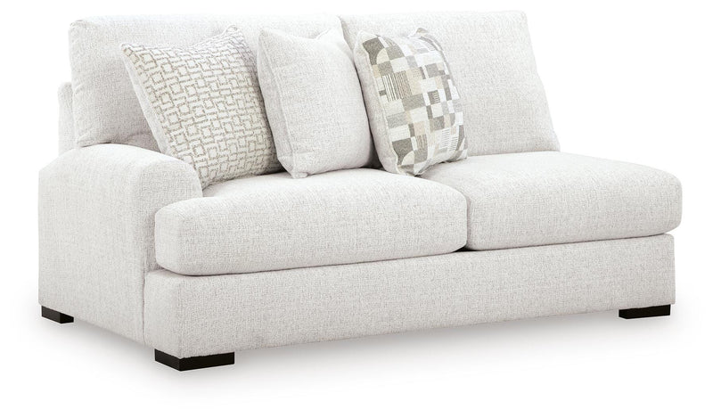Ashley Furniture Misty-Lakes sectional with chaise, showing plush fabric upholstery and modern design from an angled view.