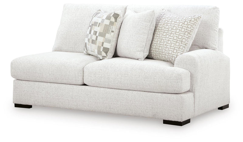 Ashley Furniture Misty-Lakes sectional with chaise, showing plush fabric upholstery and spacious seating from an angled view.
