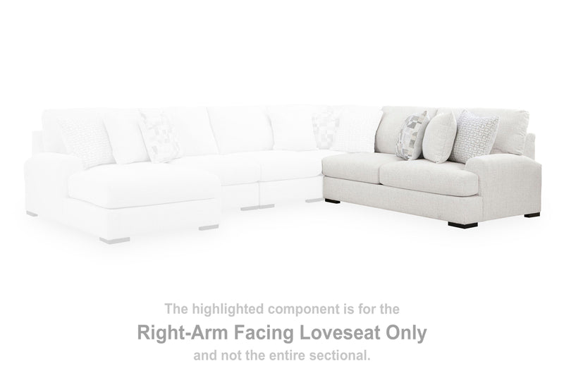Ashley Furniture Misty-Lakes sectional with chaise, showing plush fabric upholstery and modern design in a cozy living room setting.