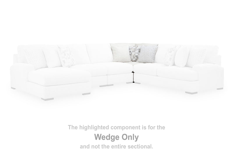 Ashley Furniture Misty-Lakes sectional with chaise, featuring plush upholstery and modern design in a cozy living room setting.