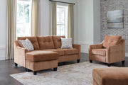 Ashley Furniture Amity Bay living room set featuring a sofa and loveseat with neutral upholstery and wooden legs.