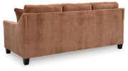 Ashley Furniture Amity Bay Chofa sofa with chaise, featuring plush cushions and a neutral fabric upholstery.