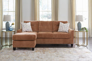 Ashley Furniture Amity Bay sofa chofa with chaise in a neutral fabric, shown with left-side chaise for a modern living room look.