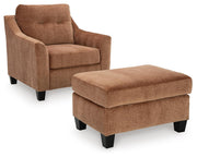 Ashley Furniture Amity Bay living room set with sofa and armchair, shown from a side angle in a cozy living space setting.