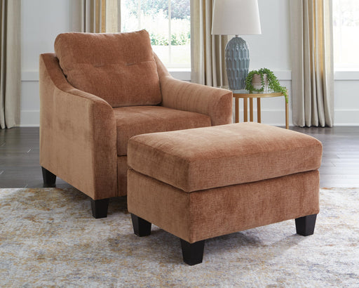 Ashley Furniture Amity Bay living room set with sofa and loveseat, featuring neutral upholstery and wooden legs.