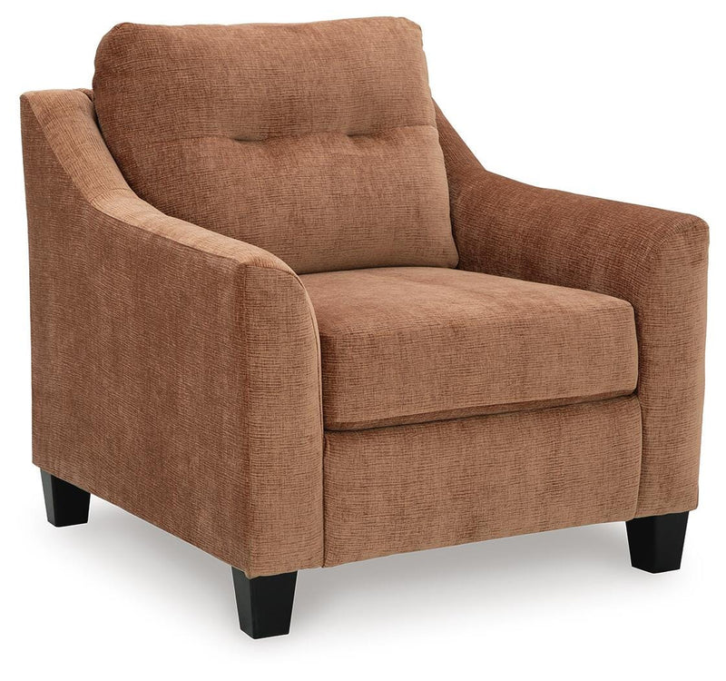 Ashley Furniture Amity Bay Chair showing a stylish, cushioned chair with wooden legs and a contemporary design.
