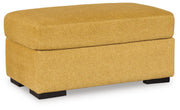 Ashley Furniture Keerwick living room set with sofa and armchair shown from an angle, featuring plush cushions and modern design.